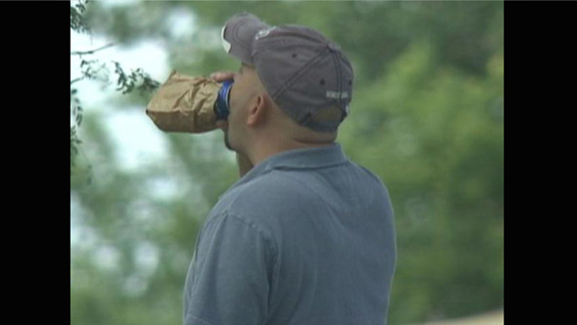 Photo shows a Chrysler worker drinking while on the job.