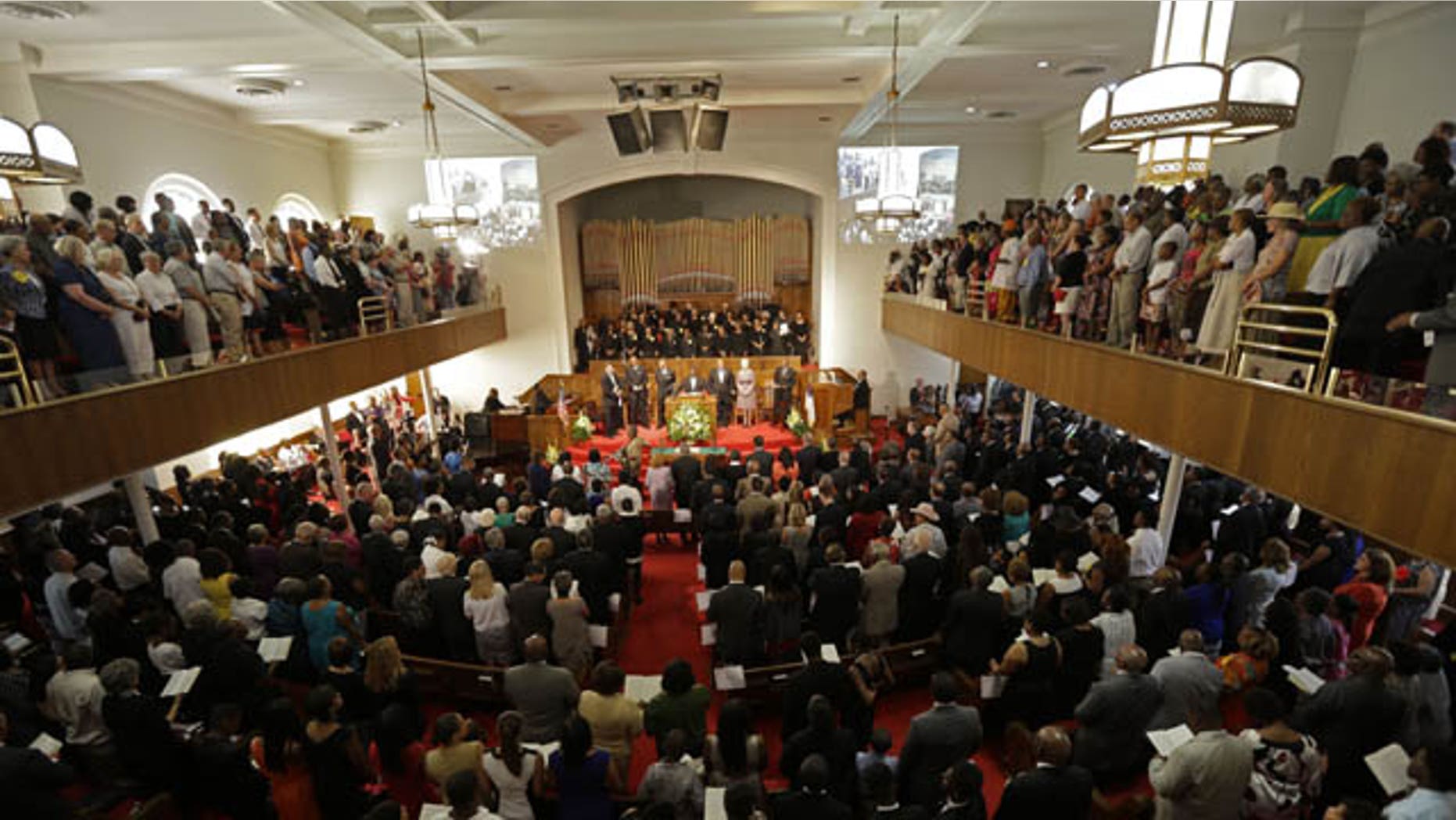 September 15, 2013: The congregation sings at the 16th Street Baptist Church in Birmingham, Ala. The church held a ceremony honoring the memory of the four young girls who were killed by a bomb placed outside the church 50 years ago by members of the Ku Klux Klan. (AP Photo)
