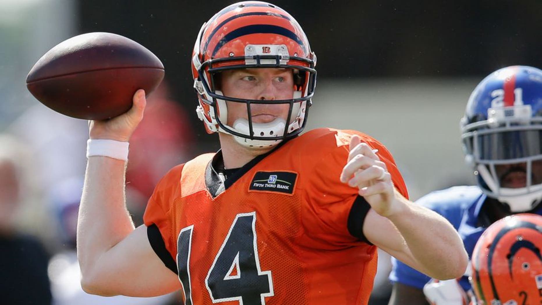 Cincinnati Bengals quarterback Andy Dalton looks to throw during a joint NFL football training camp with the New York Giants, Wednesday, Aug. 12, 2015, in Cincinnati. (AP Photo/John Minchillo)