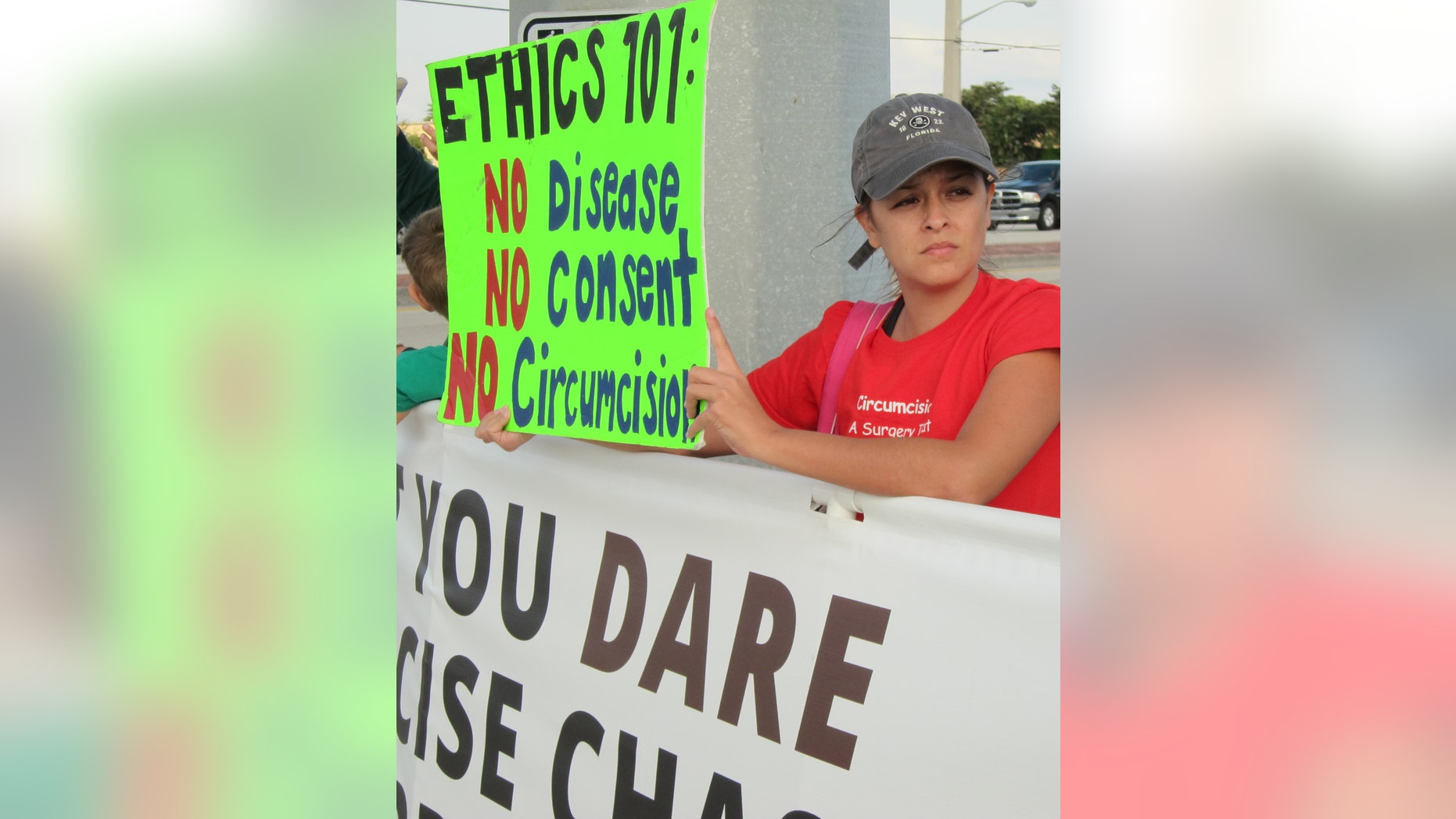 Jan. 10, 2015 - Jennifer Blanchard, 34, of Miami, protests in Boynton Beach, Fla., over the case of a little boy whose parents have been fighting over whether to circumcise him. Judges have ruled in favor of the boys father, who wants his son to undergo the procedure.