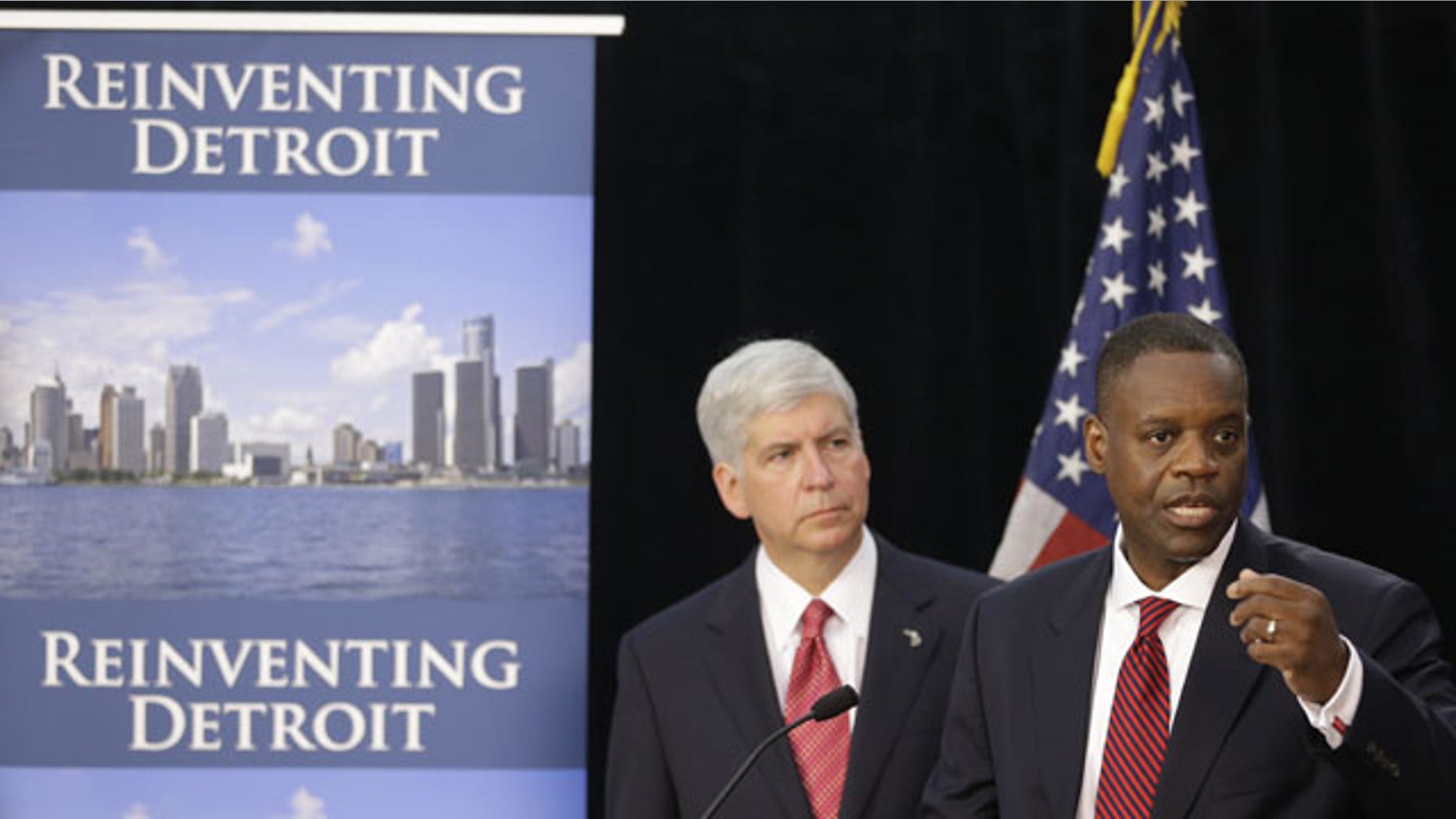 FILE - In this July 19, 2013, file photo, state-appointed emergency manager Kevyn Orr, right, and Michigan Gov. Rick Snyder, address reporters during a news conference in Detroit after Orr asked a federal judge for bankruptcy protection. (AP Photo)