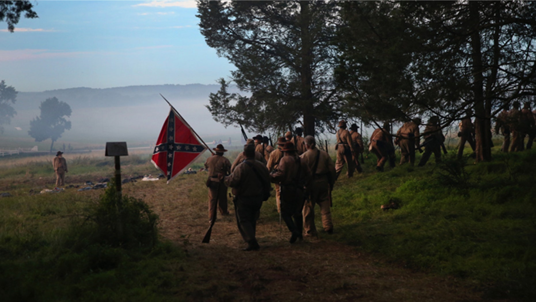 GETTYSBURG, PA - JUNE 29: Confederate Civil War re-enactors from Hood's Texas Brigade leave in defeat after an evening attack on Union troops as part of a three-day Battle of Gettysburg re-enactment on June 29, 2013 in Gettysburg, Pennsylvania. Some 8,000 re-enactors from the Blue Gray Alliance are participating in events marking the 150th anniversary of the July 1-3, 1863 Battle of Gettysburg. General Robert E. Lee's Army of Northern Virginia was defeated on the third day of the battle, considered the turning point in the American Civil War and a watershed moment in the nation's history. Union and Confederate armies suffered a combined total of some 46,000-51,000 casualties over three days, the highest of any battle the four-year war. (Photo by John Moore/Getty Images)