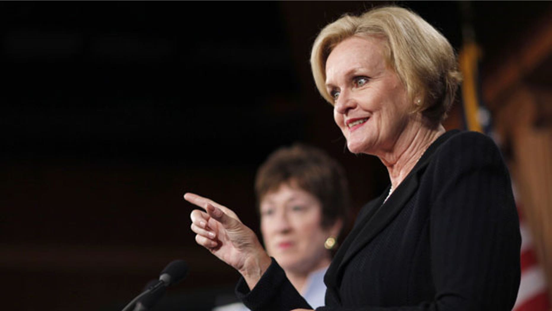 December 6, 2011: Sen. Claire McCaskill, D-Mo., right, accompanied by Sen. Susan Collins R-Maine, gestures during a news conference on Capitol Hill in Washington.
