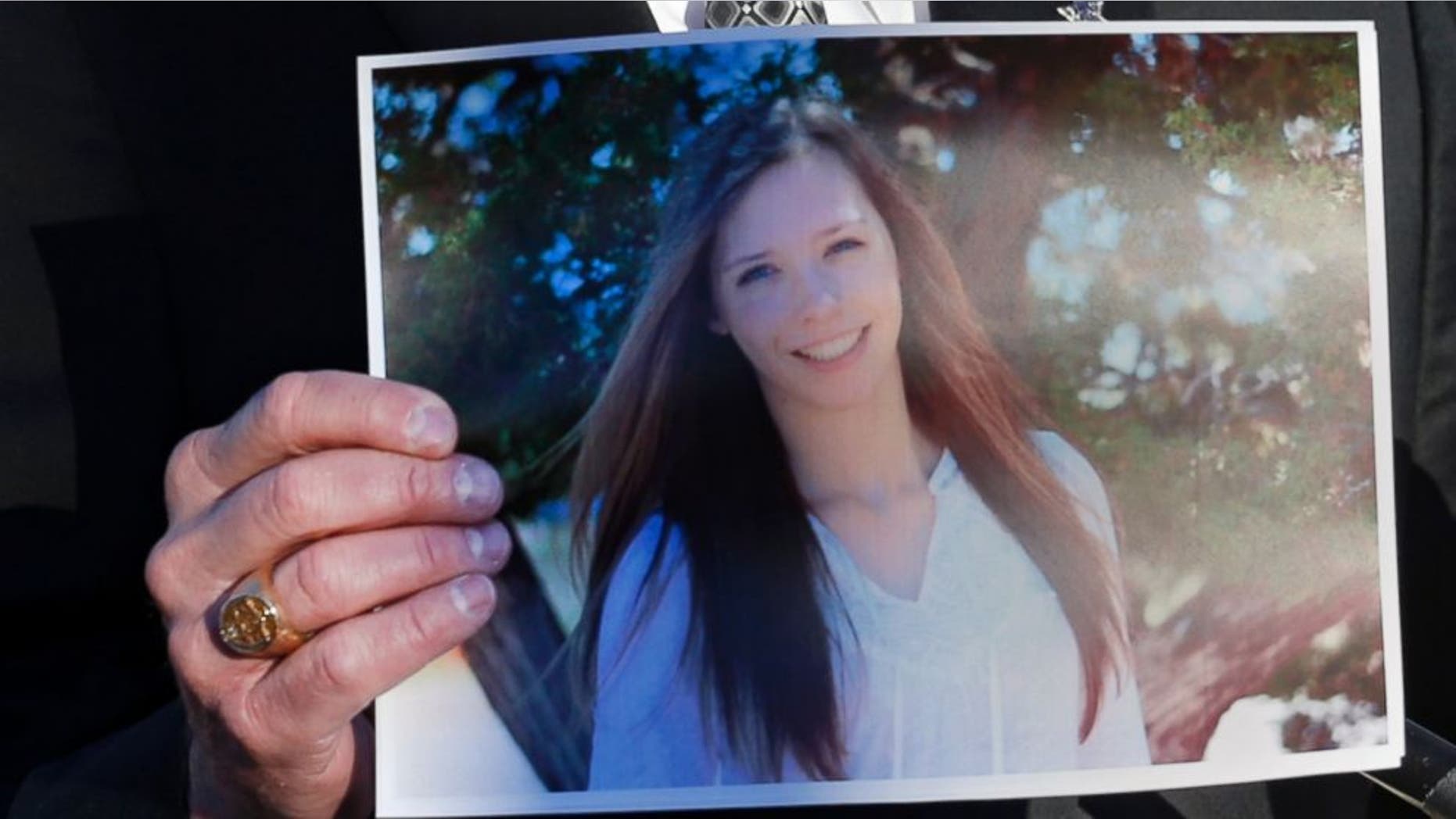 Dec. 14, 2013: Arapahoe County Sheriff Grayson Robinson holds a picture of Claire Davis, the 17-year-old student who was shot in the head by a classmate, during a briefing at Arapahoe High School in Centennial, Colo.