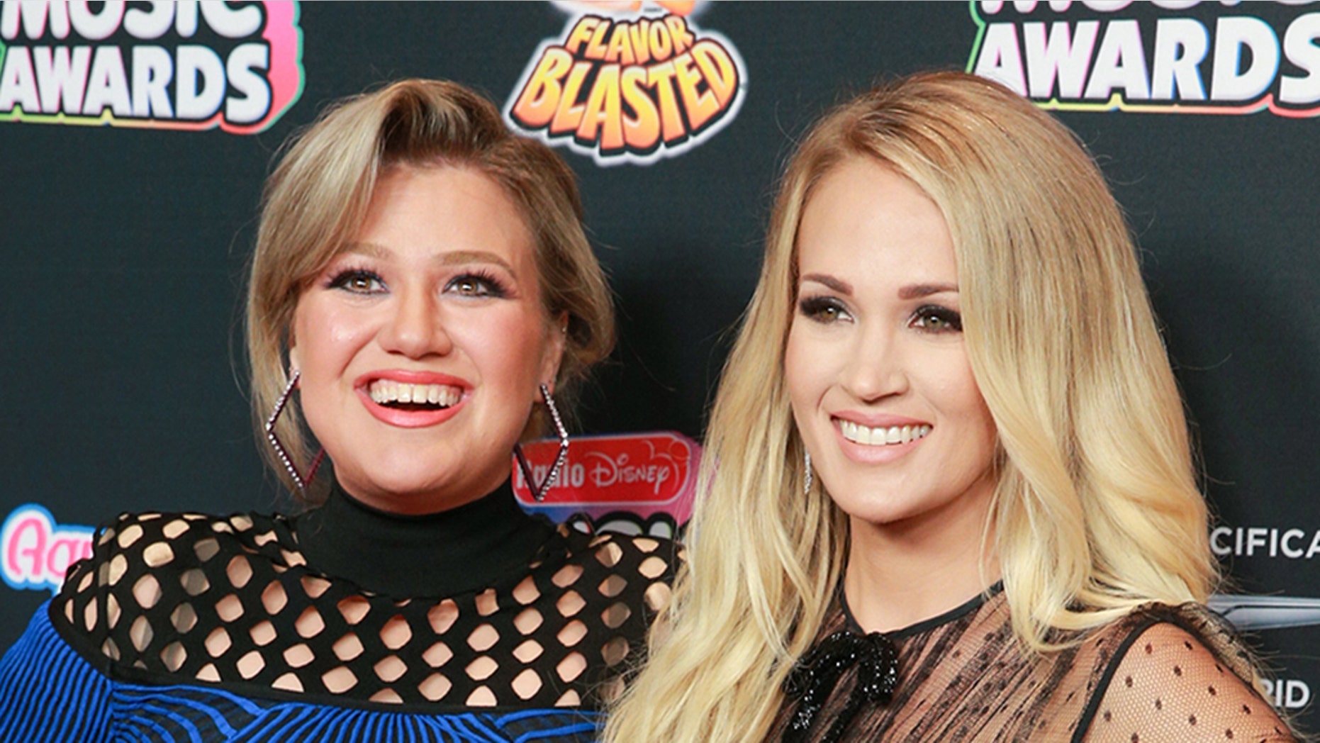 HOLLYWOOD, CA - JUNE 22: Kelly Clarkson (L) and Carrie Underwood attend the 2018 Radio Disney Music Awards at Loews Hollywood Hotel on June 22, 2018 in Hollywood, California. (Photo by Rich Fury/Getty Images)