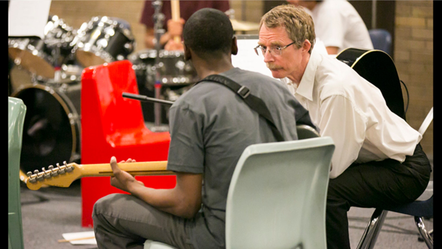 April 14, 2013: Chicago Symphony Orchestra Bass Dan Armstrong talks to an unidentified inmate during their music performance for inmates as part of the CSO's Citizen Musician program which brings music to a variety of locations including prisons.