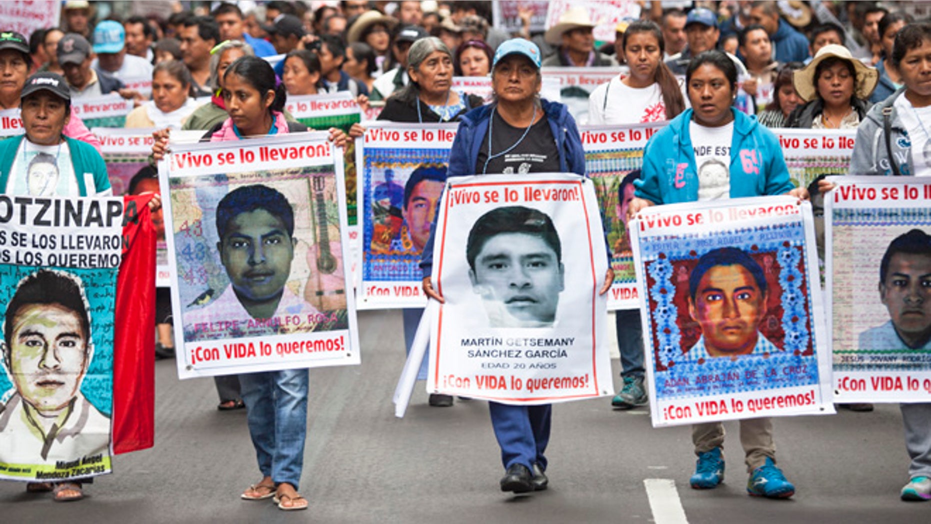 Family of 43 missing students from Ayotzinapa Normal school lead a protest, September 26, 2015 in Mexico City.