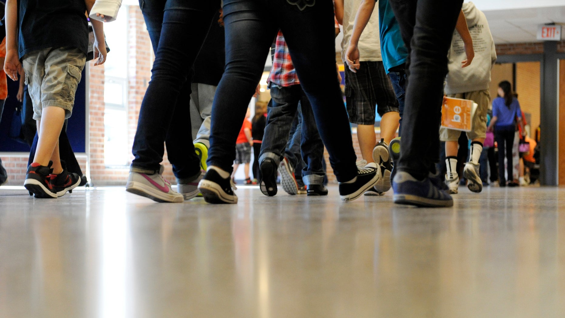 Sept. 11, 2012: File photo, students walk in the hallways as they enter the lunch line of the cafeteria at Draper Middle School in Rotterdam, N.Y. School for thousands of public school students is about to get quite a bit longer. Five states announced Monday, Dec. 3, 2012, they will add at least 300 hours of learning time to the calendar in some schools starting in 2013.