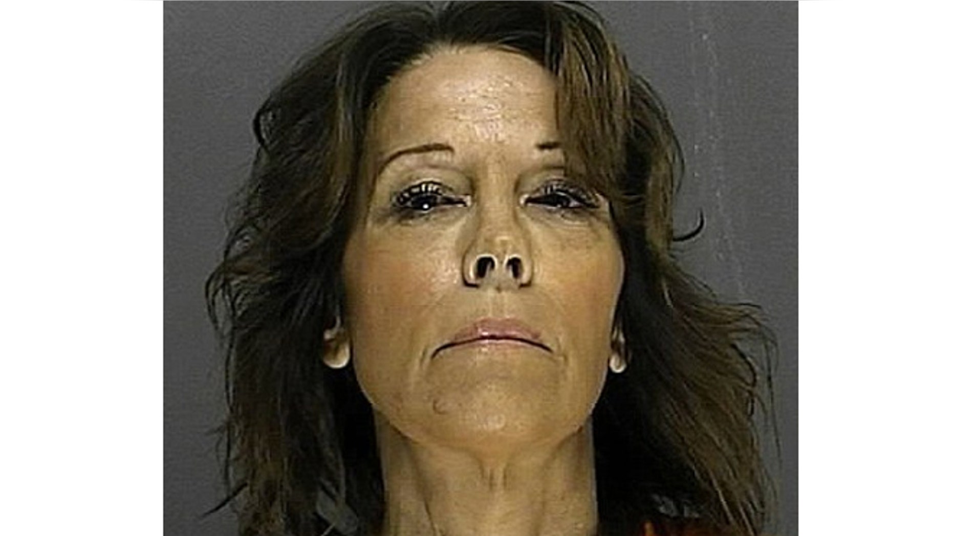 Claudia Ambroziak was arrested after acting out how she says her husband tried to choke her on a police officer.