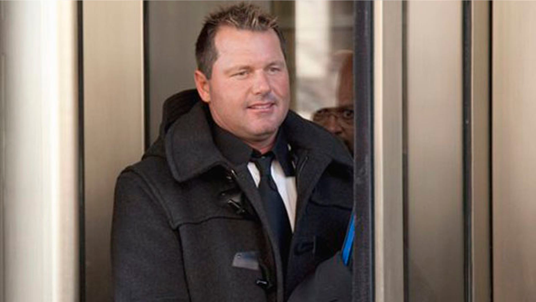 In this Feb. 2, 2011 file photo, former Major League Baseball pitcher Roger Clemens leaves federal court in Washington. Clemens says he's eager to defend himself in federal court this summer. The seven-time Cy Young winner says prosecutors have damaged the reputations of others as they've tried to prove that he lied to a congressional committee about alleged steroid use.