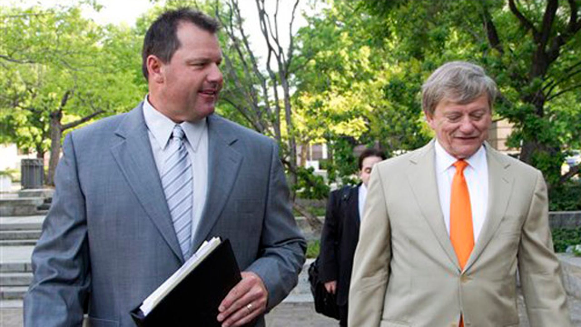 April 16, 2012: Former Major League Baseball pitcher Roger Clemens, and his attorney Rusty Hardin, arrive at federal court in Washington for jury selection in the perjury trial on charges that he lied when he told Congress he never used steroids and human growth hormone.