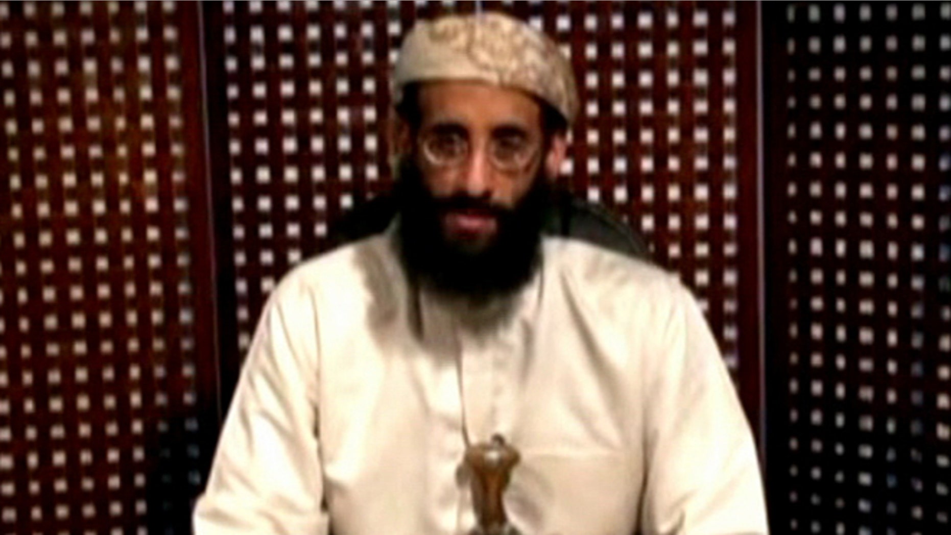 Sept. 30, 2011: Anwar al-Awlaki, a U.S.-born cleric linked to Al Qaeda's Yemen-based wing, gives a religious lecture in an unknown location in this still image taken from video released by Intelwire.com.