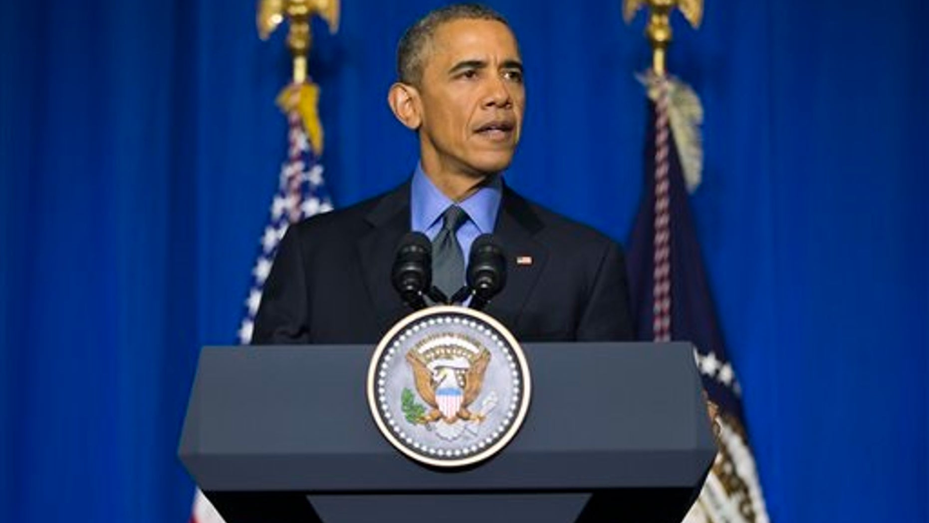 U.S. President Barack Obama speaks during a news conference at the Organization for Economic Cooperation and Development Centre, in Paris, on Tuesday, Dec. 1, 2015. Obama discussed the COP21 climate change summit, and the threat of terrorism from the Islamic State Group. (AP Photo/Evan Vucci)