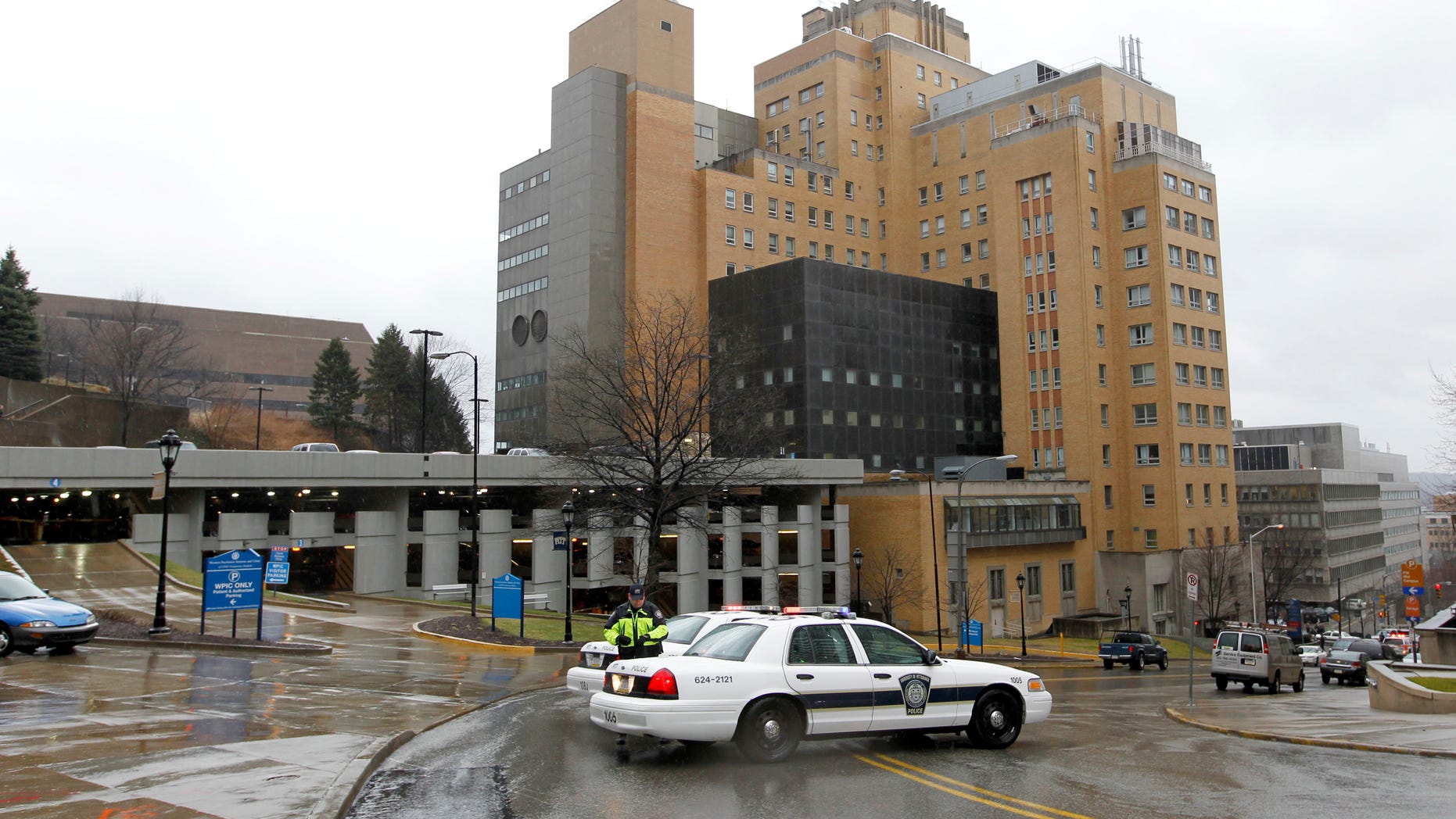 March 8, 2012: Police block the rear entrance to the Western Psychiatric Institute and Clinic on the University of Pittsburgh campus after a shooting.