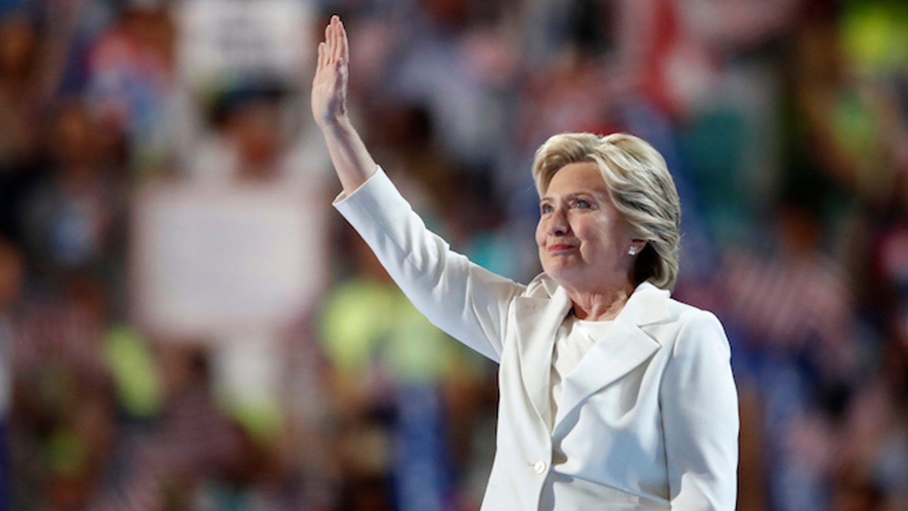 Democratic presidential nominee Hillary Clinton waves after taking the stage during the final day of the Democratic National Convention in Philadelphia , Thursday, July 28, 2016. (AP Photo/Paul Sancya)