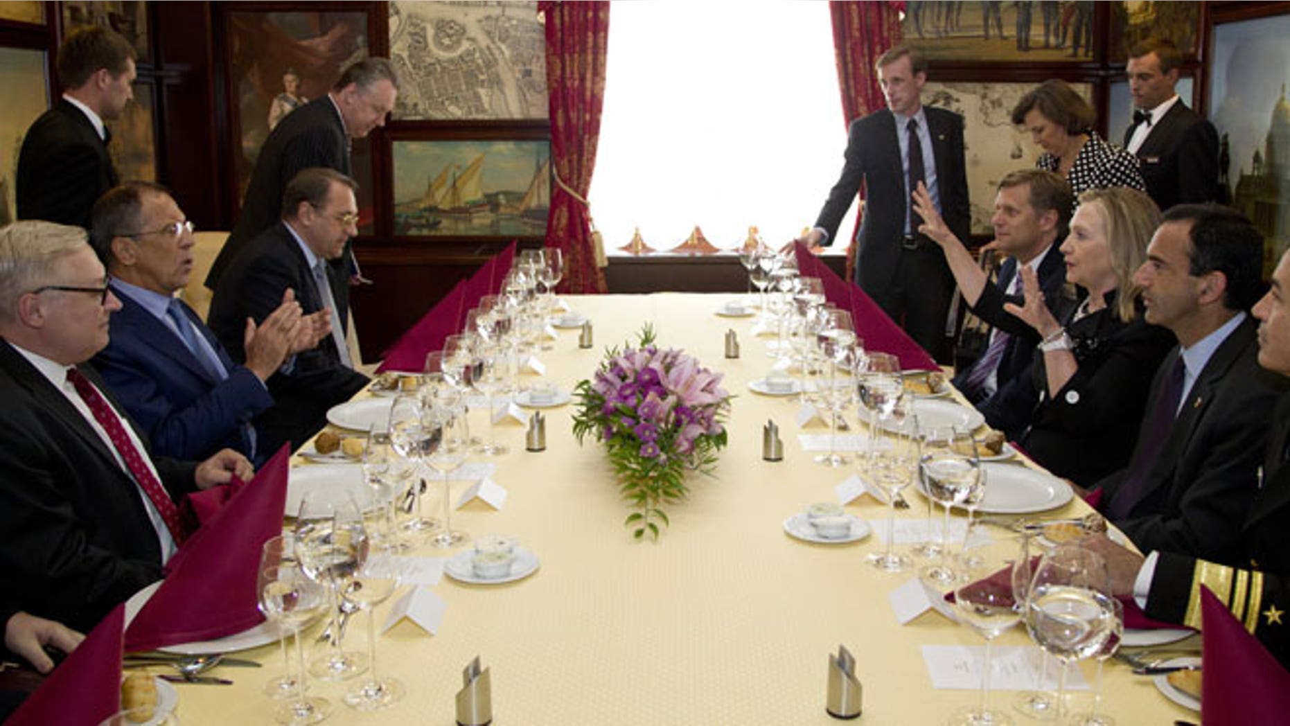 June 29, 2012: Secretary of State Hillary Rodham Clinton, center right, and Russian Foreign Minister Sergey Lavrov, center left, sit down for dinner in St. Petersburg, Russia.