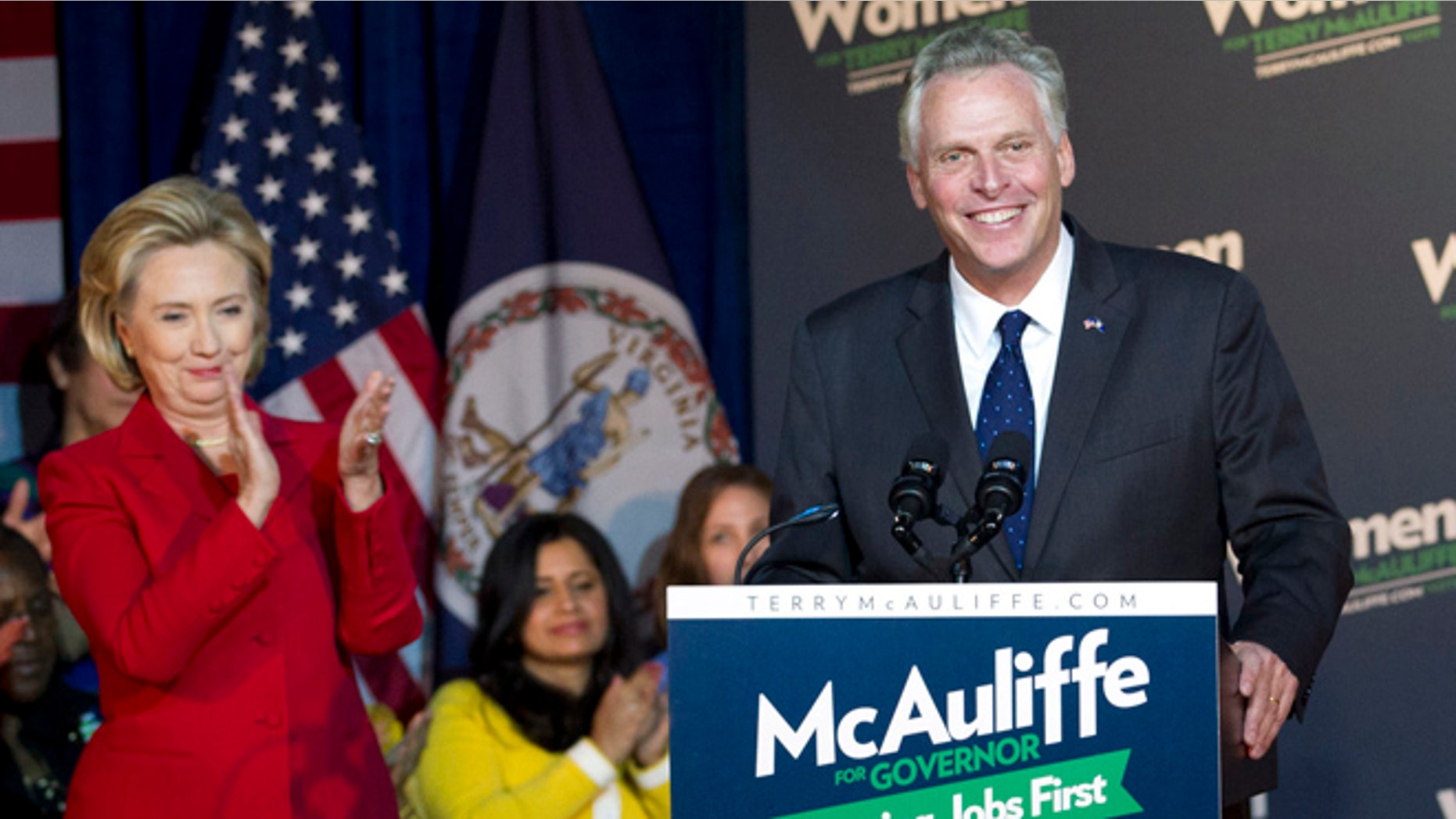 Saturday, Oct. 19, 2013.: Former Secretary of State Hillary Clinton applauds Virginia gubernatorial candidate, Democrat Terry McAuliffe, during a campaign rally, Women for Terry, at the State Theater in Falls Church, Va.