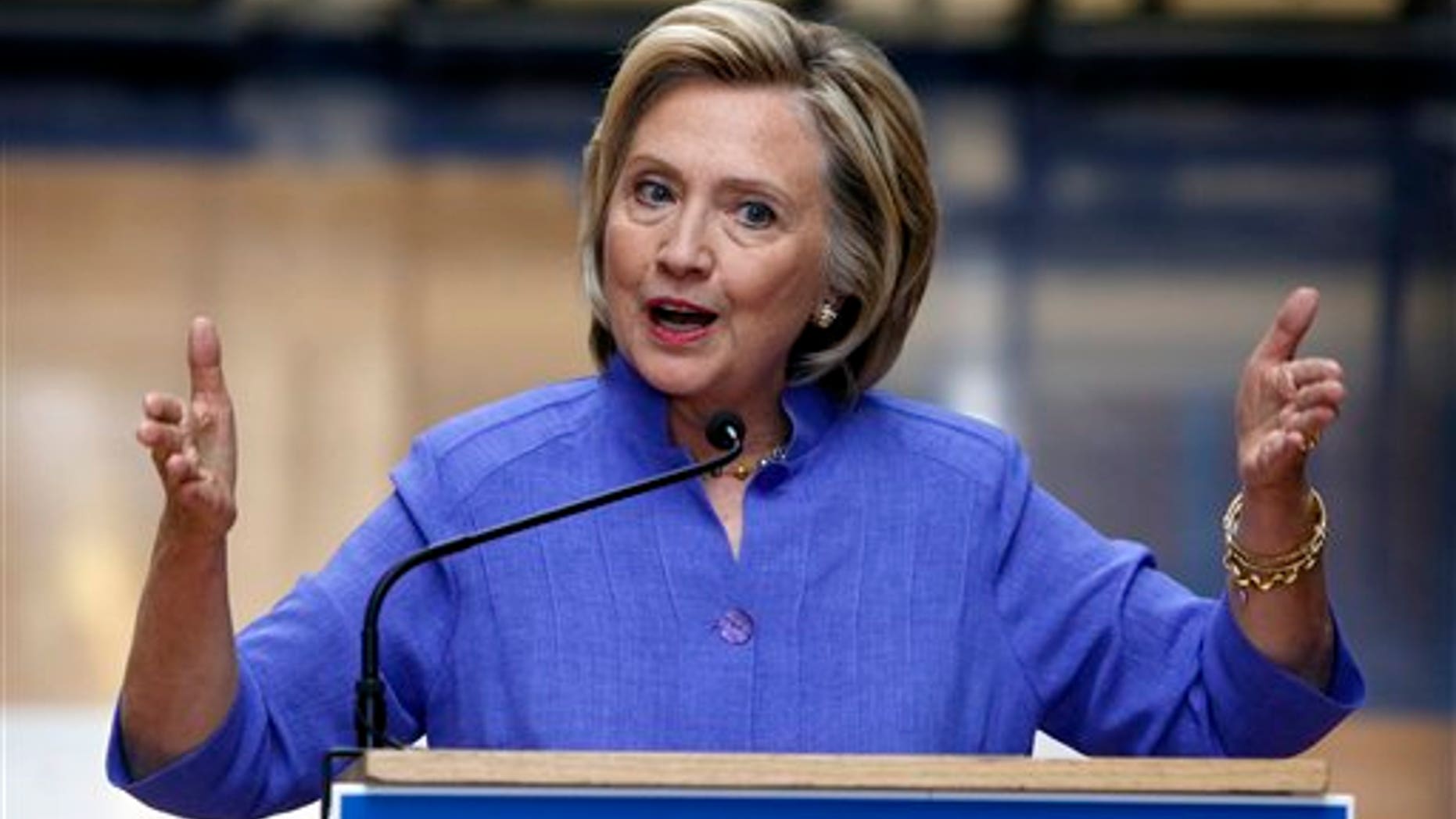 Aug. 10: Democratic presidential candidate Hillary Clinton answers reporters questions after announcing her college affordability plan at the high school in Exeter, N.H.