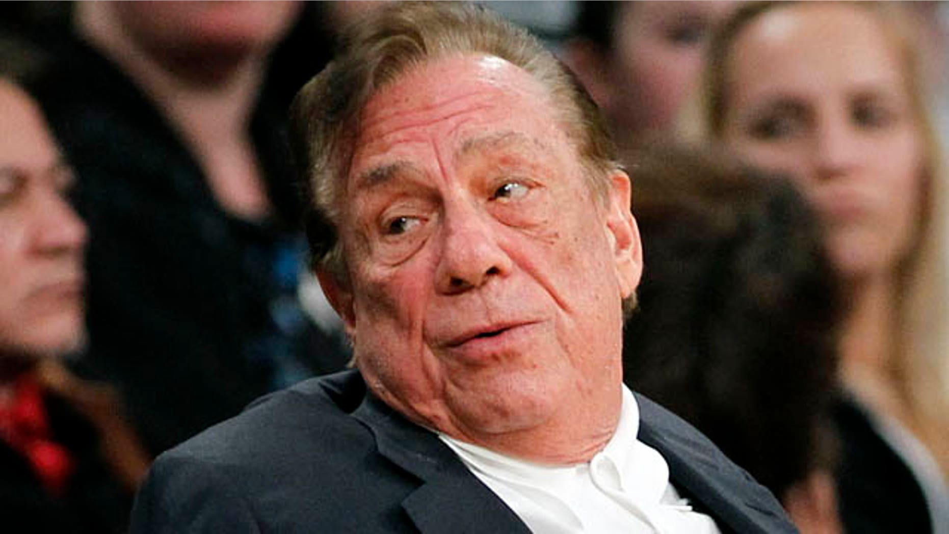 FILE - In this Dec. 19, 2011, file photo, Los Angeles Clippers owner Donald Sterling gestures while watching the Clippers play the Los Angeles Lakers during an NBA preseason basketball game in Los Angeles. (AP Photo/Danny Moloshok, File)
