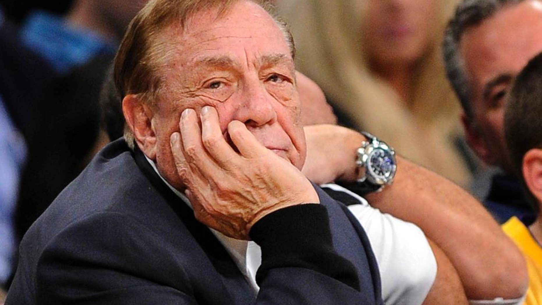FILE - In this Feb. 25, 2011, file photo, Los Angeles Clippers owner Donald Sterling looks on during the first half of their NBA basketball game against the Los Angeles Lakers in Los Angeles. Sterling could use lawyers and lawsuits to challenge the NBA’s plan to force him out over recent racist comments, but legal experts say the league would likely prevail in the end. Sports law experts say the NBA’s constitution gives its Board of Governors broad latitude in league decisions including who owns the teams. NBA Commissioner Adam Silver wants a swift vote against Sterling, which requires a minimum of three-fourths of the other 29 controlling owners to agree. (AP Photo/Mark J. Terrill, File)