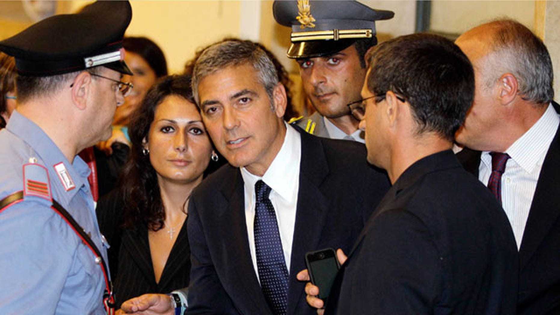July 16: Actor George Clooney leaves a tribunal in Milan, Italy. Clooney appeared in court as a witness in a fraud trial against defendants charged with co opting his name for a line of clothing.