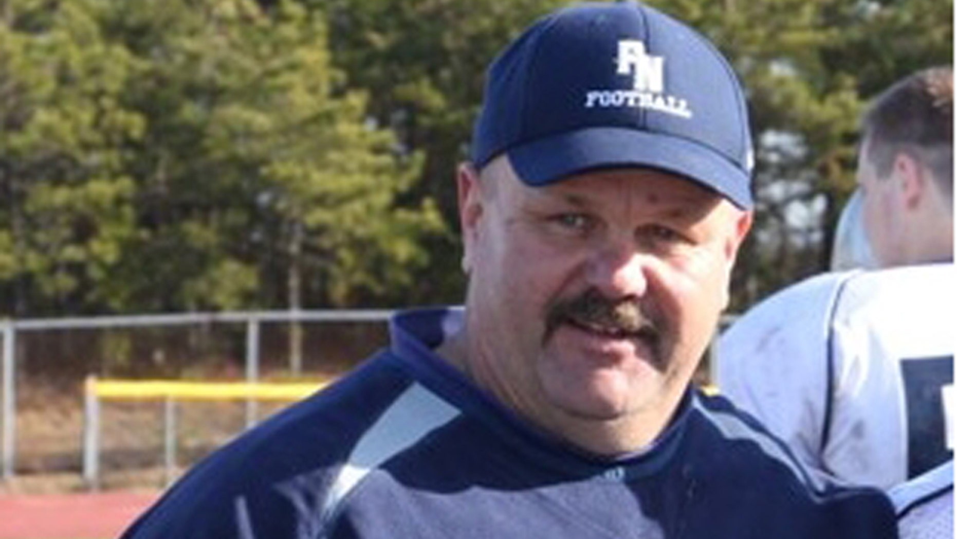 This undated photo, provided by a former North Plymouth High School student, shows coach Dwayne Follette.
