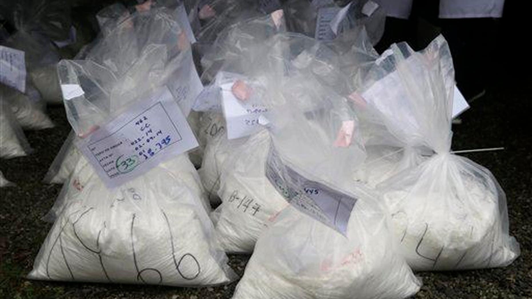 Bags of seized cocaine sit before they're incinerated at a police base in Lima, Peru.