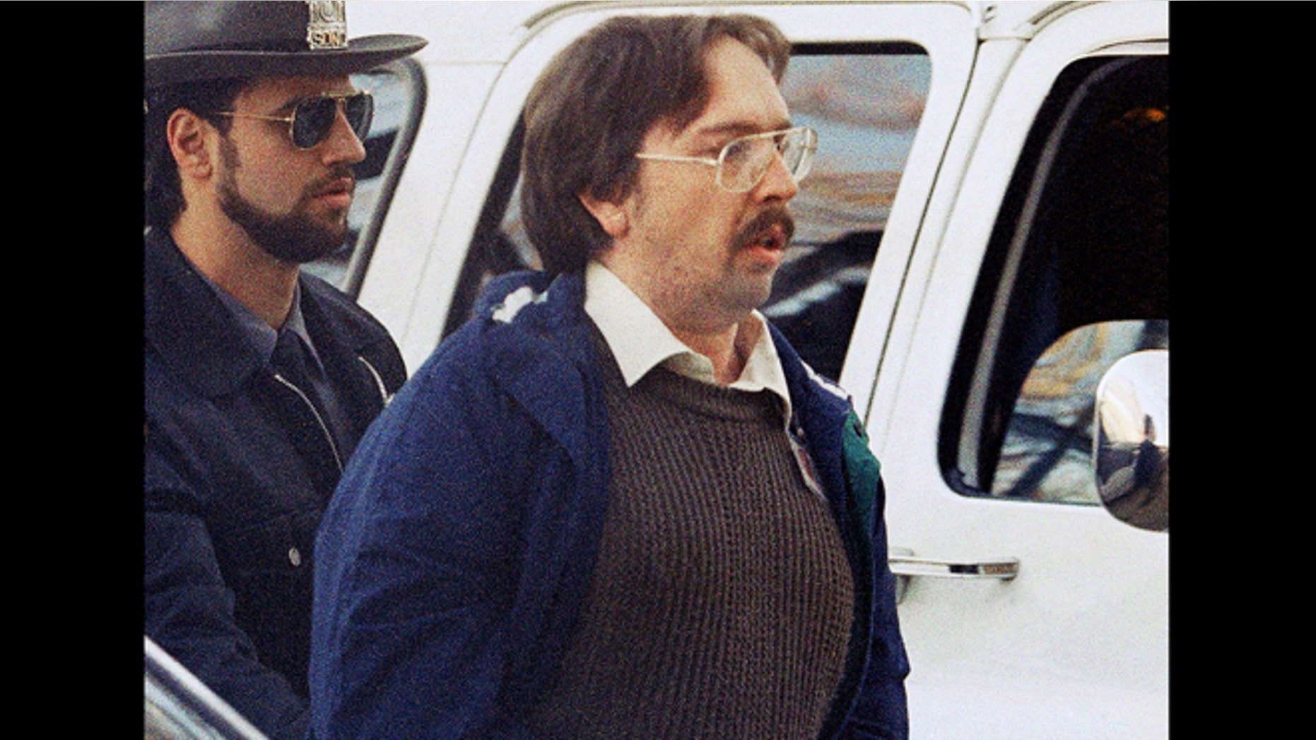 In this Dec. 17, 1993 file photo, Joel Rifkin, right, is led to the Nassau County Courthouse in Mineola, N.Y., for a suppression hearing. New Jersey State Police said Wednesday, March 27, 2013, that 25-year-old Heidi Balch likely was the first victim of Rifkin, who is in prison in New York after admitting he killed 17 women in the early 1990s. Balchs severed head was found on a golf course in Hopewell Township, near Trenton, N.J., in March 1989.