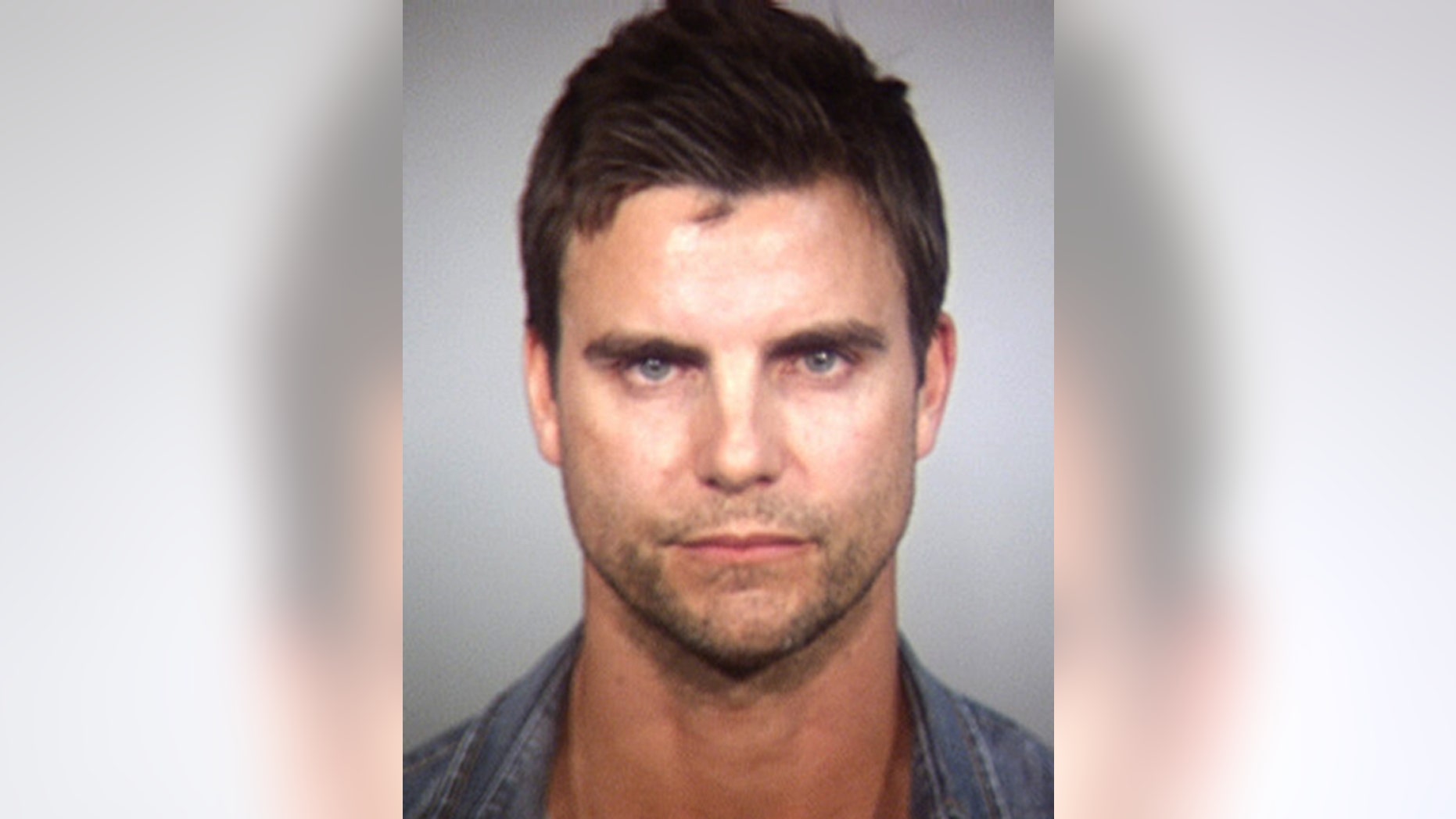 In this Tempe Police Department booking photo released Wednesday, April 2, 2014, shows Colin Egglesfield in Tempe, Ariz.