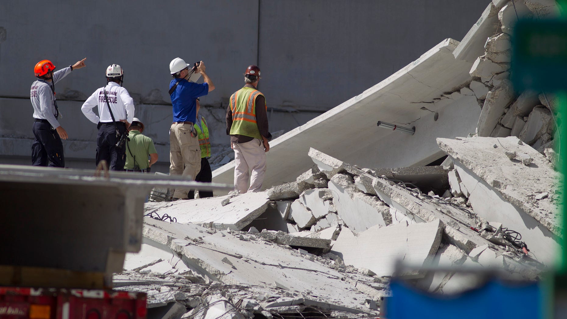 Oct. 11, 2012 - Rescue officials survey damage in the collapsed parking garage at the Miami Dade College West campus in Doral, Florida