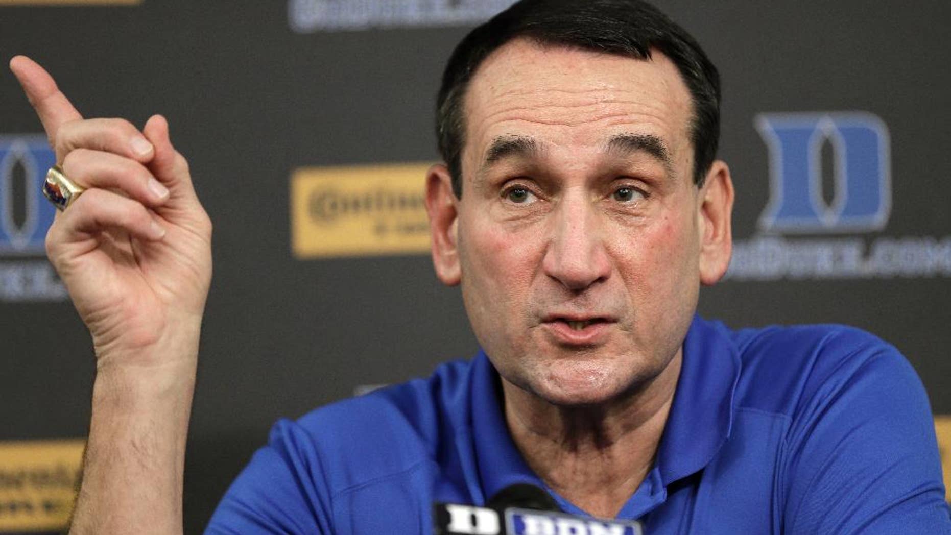 FILE - In this Sept. 18, 2014, file photo, Duke basketball coach Mike Krzyzewski speaks to members of the media during a press conference in Durham, N.C. Duke is No. 4 in The Associated Press preseason Top 25.(AP Photo/Gerry Broome, File)