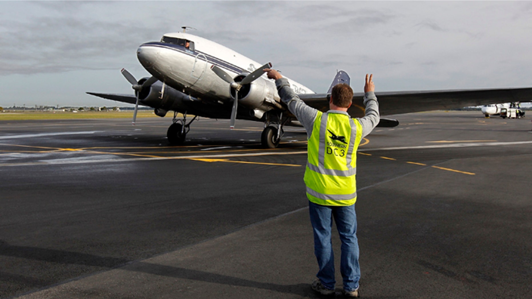 CHRISTCHURCH, NEW ZEALAND - JUNE 17: Southern DC3 ZK-AMY aircraft on on the tarmac on June 17, 2011 in Christchurch, New Zealand. The Crusaders Super Rugby team chartered the historic DC3 ZK-AMY aircraft, as commercial airlines cancel flights due to volcanic ash clouds and safety concerns. The Crusaders play the Hurricanes at Westpac Stadium on Saturday. (Photo by Martin Hunter/Getty Images)