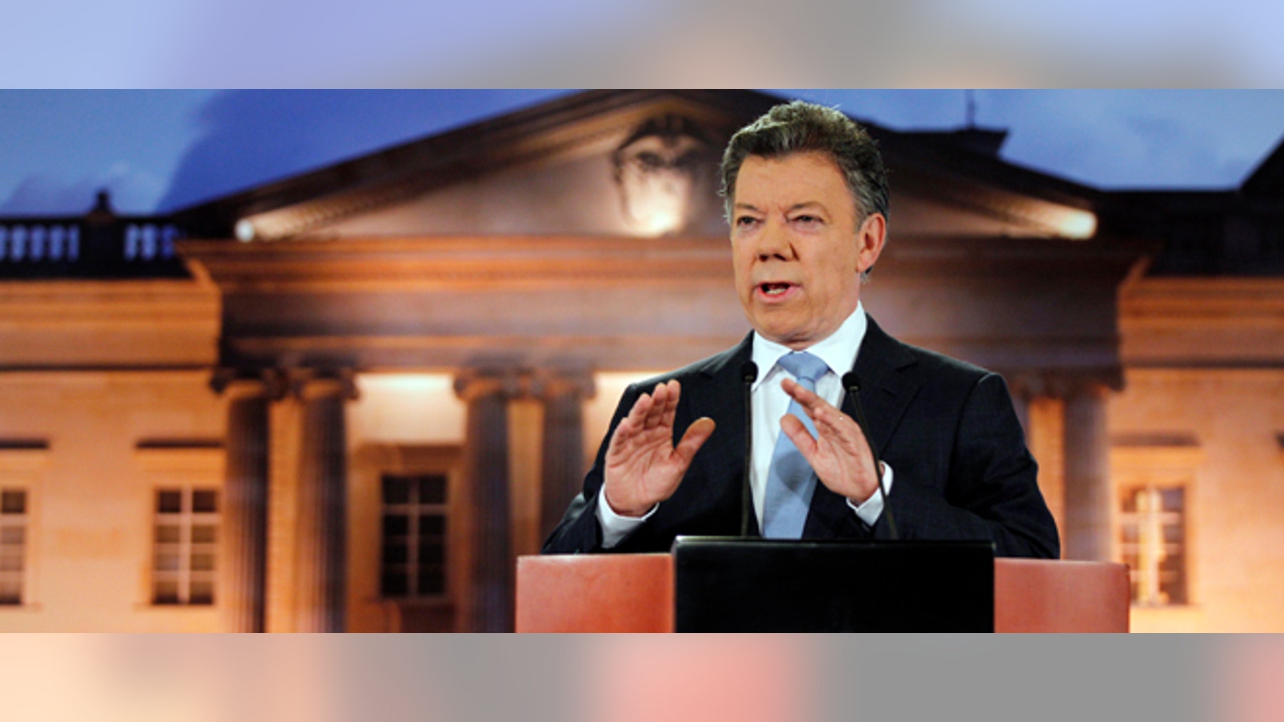 Colombia's President Juan Manuel Santos delivers a speech during a televised address to the nation at the presidential palace in Bogota, Colombia, Monday, Aug. 27, 2012. Santos said his government has held exploratory talks with rebels of the the leftist Revolutionary Armed Forces of Colombia, FARC. (AP Photo/Fernando Vergara)