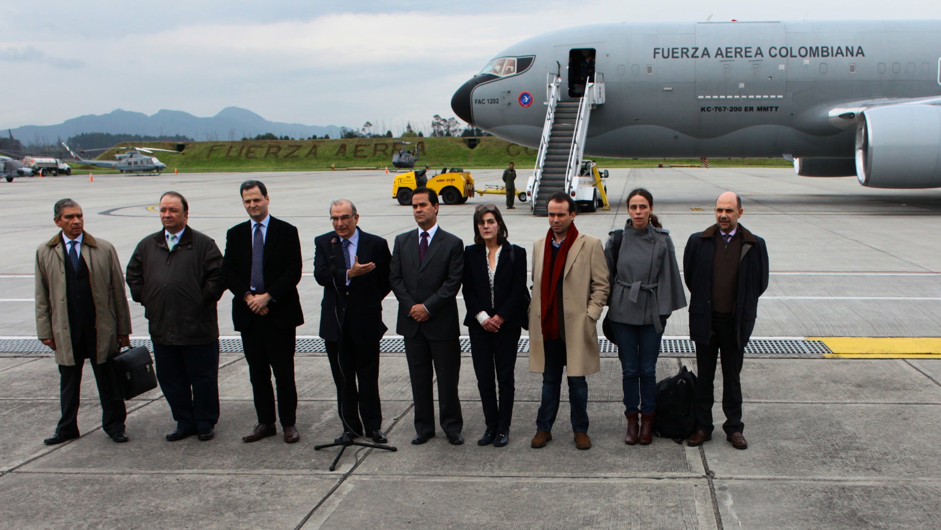 Oct. 16, 2012: Colombia's government team for the peace talks with Colombia's Revolutionary Armed Forces ( FARC ) pose for a photo before embarking on an Colombian Air Force plane to Oslo at the military airport in Bogota, Colombia.