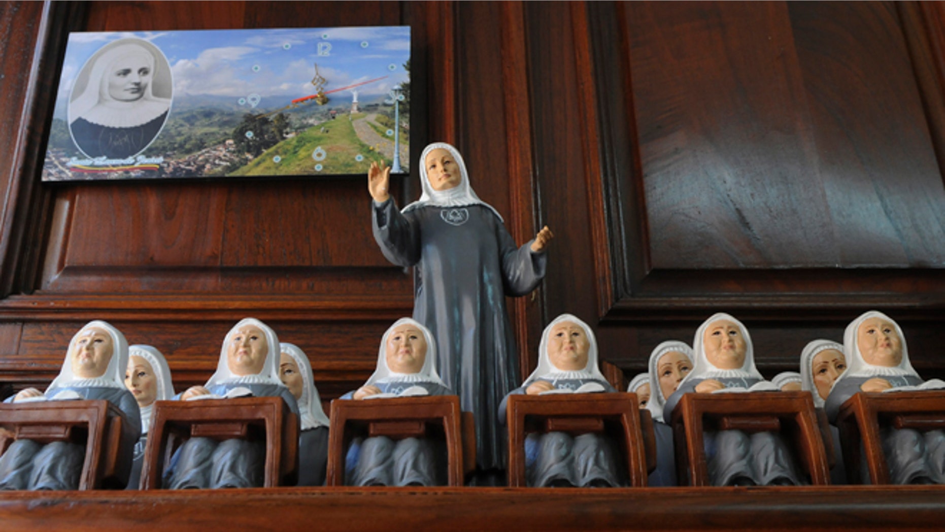 Statues of Mother Laura Montoya sit on display for sale in her hometown of Jerico, Colombia, Friday, May 10, 2013. Mother Laura, who was born in 1874 and dedicated her life to working with indigenous and poor people, will become the country's first saint when Pope Francis canonizes her on Sunday. (AP Photo/Luis Benavides)