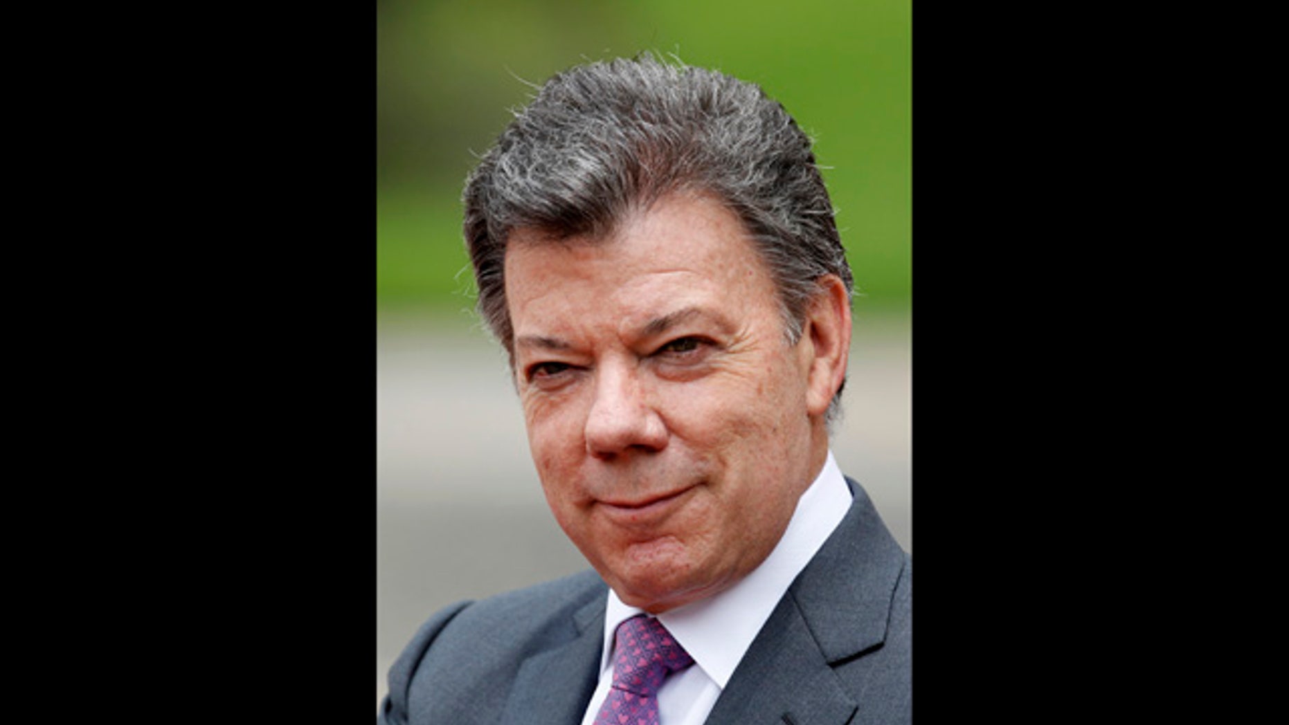 April 19, 2012: Colombia's President Juan Manuel Santos waits for the arrival of Spain's Prime Minister Mariano Rajoy at the presidential palace in Bogota, Colombia. Santos said on Monday, Oct. 1, 2012, he suffers from prostate cancer and he will undergo surgery next Wednesday at a clinic in Bogota.