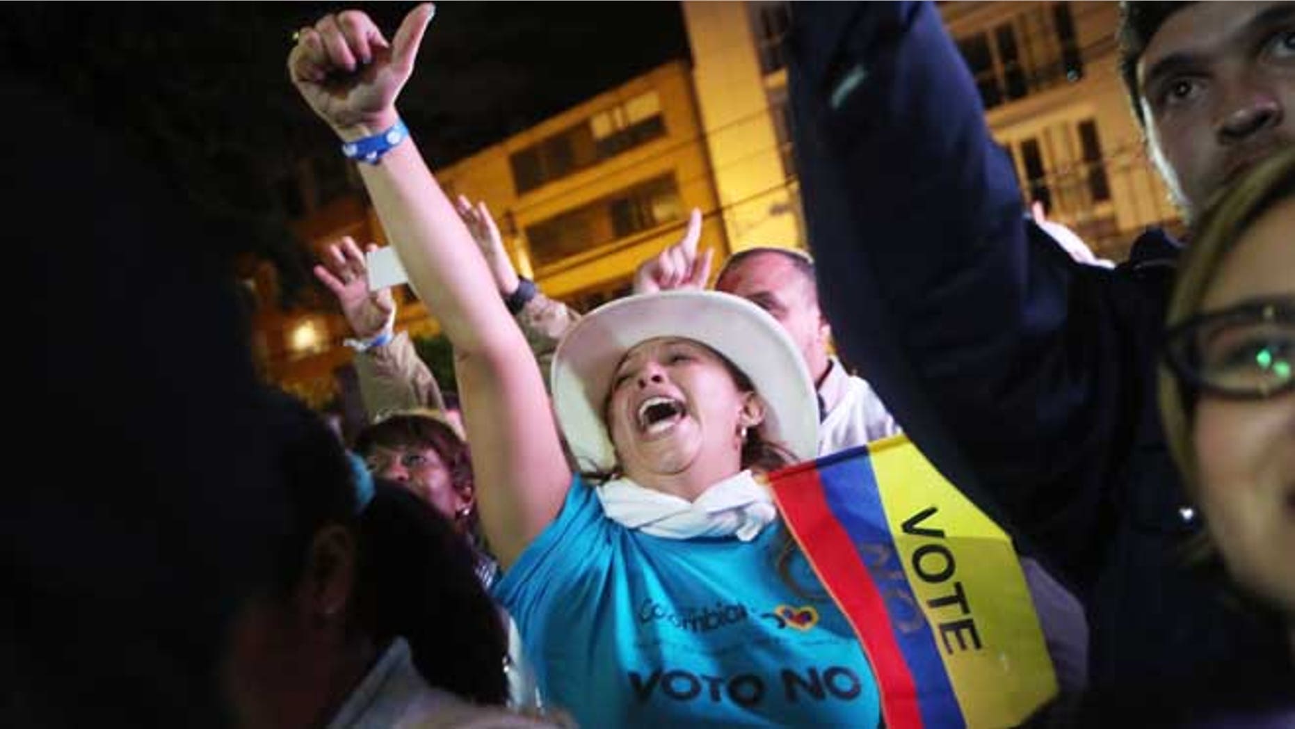 BOGOTA, COLOMBIA - OCTOBER 02: 'No' supporters celebrate at a rally following their victory in the referendum on a peace accord to end the 52-year-old guerrilla war between the FARC and the state on October 2, 2016 in Bogota, Colombia.