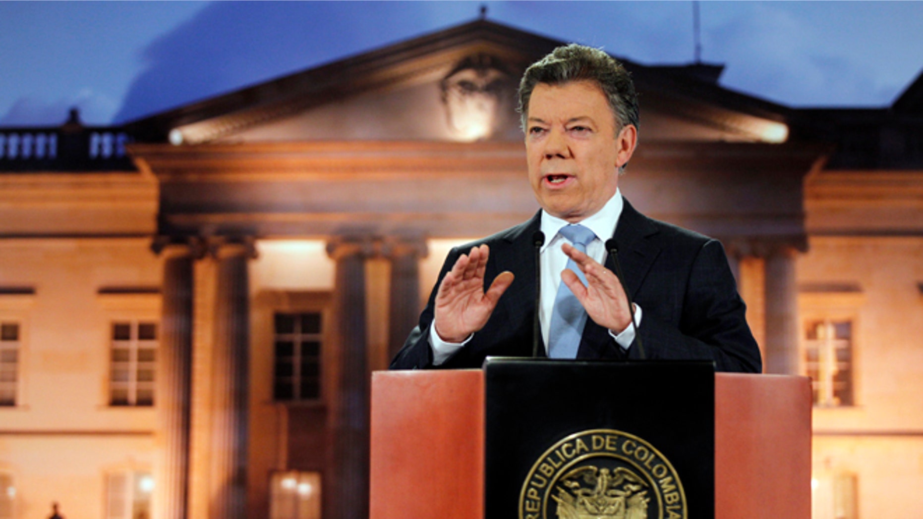 Colombia's President Juan Manuel Santos delivers a speech during a televised address to the nation at the presidential palace in Bogota, Colombia, Monday, Aug. 27, 2012. (AP Photo/Fernando Vergara)