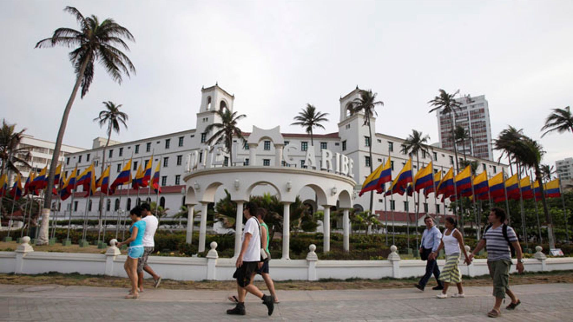 April 14, 2012: People walk past Hotel El Caribe in Cartagena, Colombia.