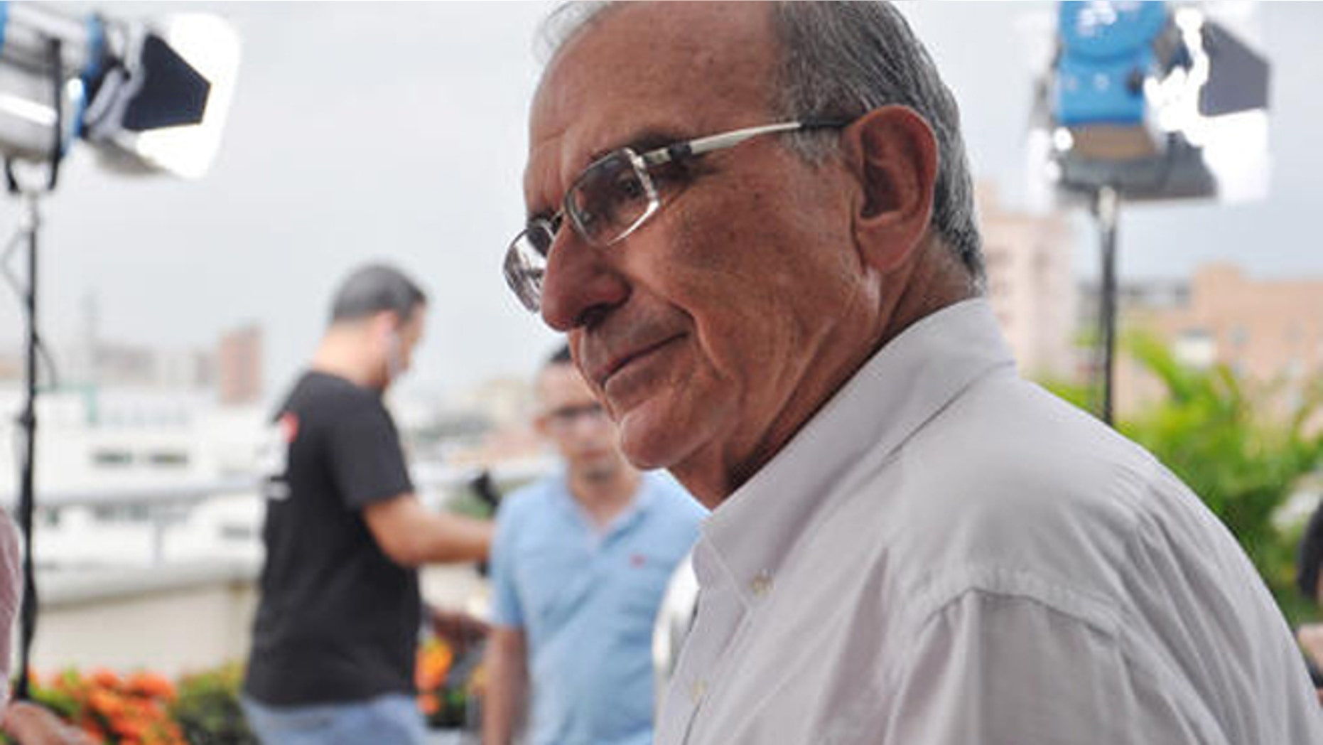 In this Sept. 14, 2016 photo, the chief peace negotiator for the Colombian government, Humberto De la Calle, talks to an aide in Barranquilla, Colombia. After securing in Cuba a historic peace deal with the FARC rebels, some are talking about him as a possible successor to Colombia's President Juan Manuel Santos in 2018. Santos will sign the peace accord next week and Colombians will be asked in an Oct. 2 referendum to ratify or reject the deal. (AP Photo/Joshua Goodman)