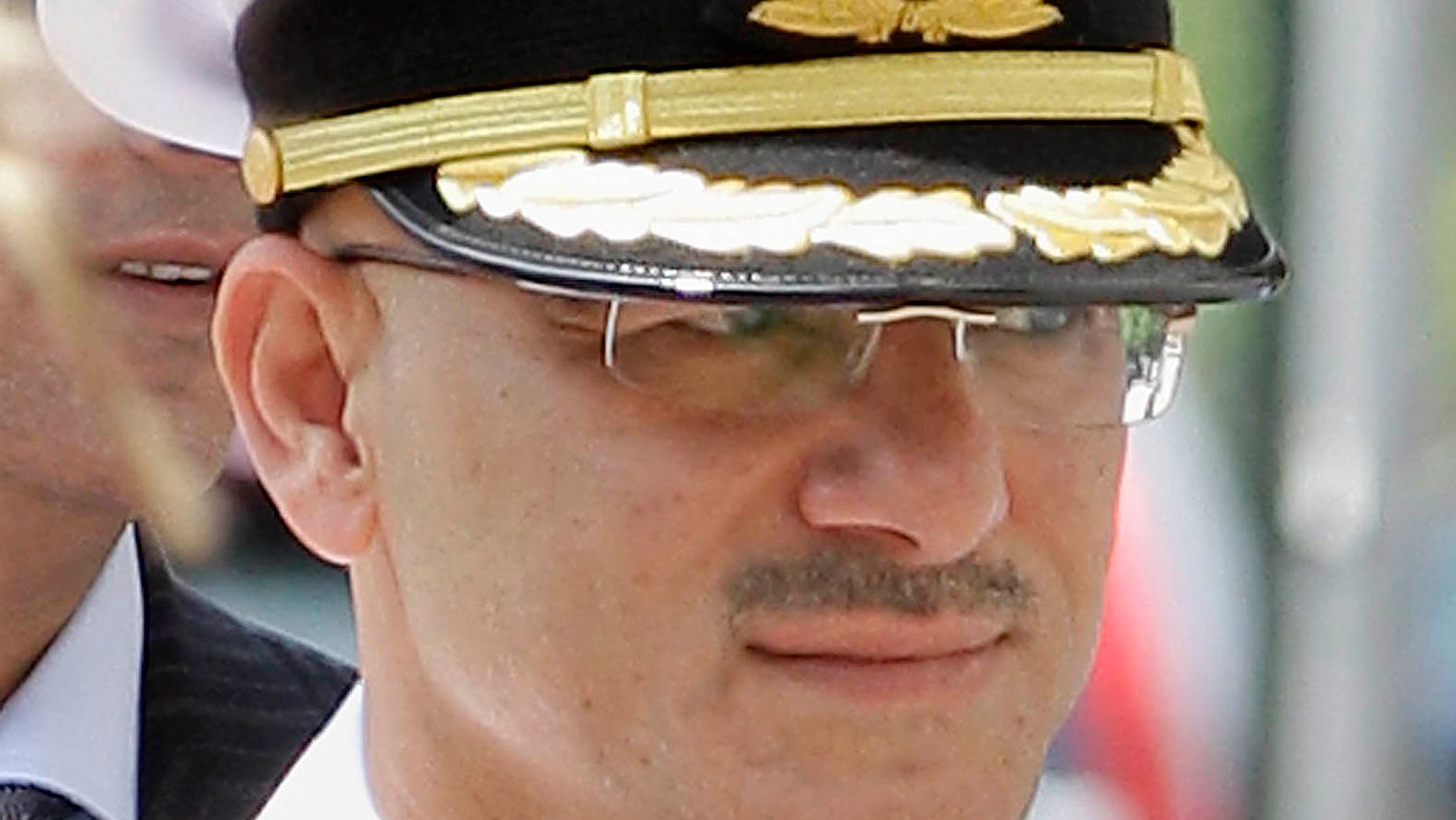 July 19: United Arab Emirates Col. Arif Mohamed Saeed Mohamed Al-Ali enters Federal Court in Providence, R.I. The trial of the United Arab Emirates naval officer accused of keeping an unpaid servant in his Rhode Island home, was put on hold for two days after the defense raised concerns about the accuracy of the translation service provided by an interpreter.