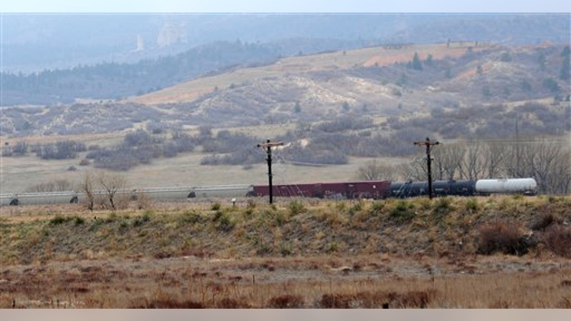 April 20: A train with a car leaking hydrochloric acid is parked on the tracks between Baptist Road and Monument, Colo. About 255 homes were evacuated. (AP/The Gazette)