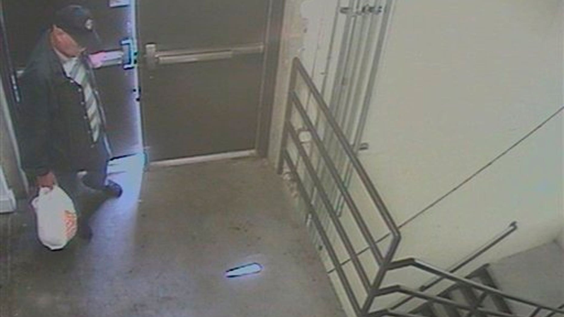 April 20: Image taken from surveillance video provided by the FBI shows person of interest sought in a fire and the planting of a pipe bomb near a food court at the Southwest Plaza Mall in Littleton, Colorado.
