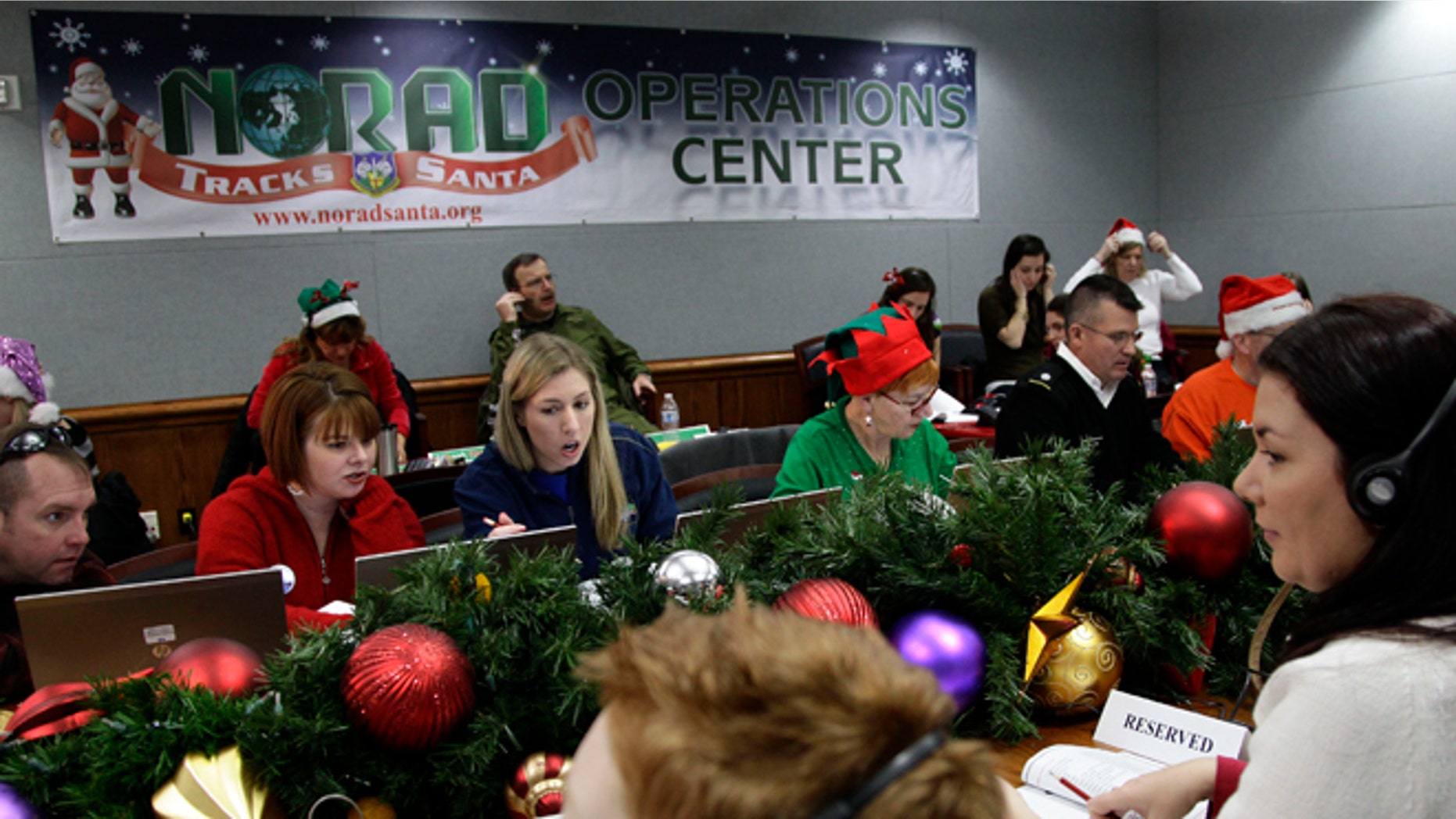 Dec. 24, 2012: Volunteers take phone calls from children asking where Santa is and when he will deliver presents to their house, during the annual NORAD Tracks Santa Operation, at the North American Aerospace Defense Command, or NORAD, at Peterson Air Force Base, in Colorado Springs, Colo.