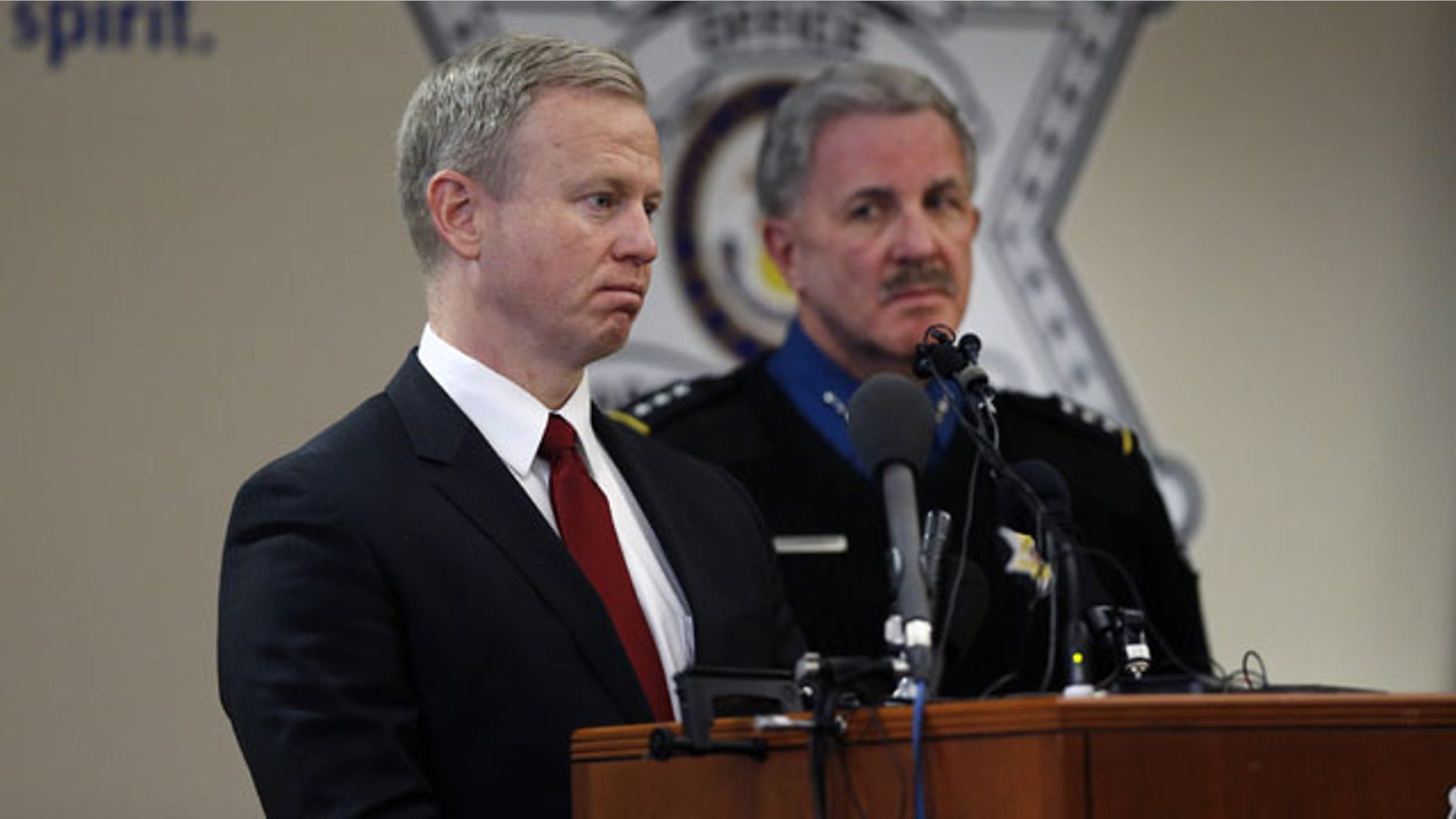 December 30, 2013: District Attorney for the 18th Judicial District George Brauchler, left, and Arapahoe County Sheriff Grayson Robinson take questions during a news conference at which they and other officials discussed the investigation into the Dec. 13 shooting at Arapahoe High School in Centennial, Colo. (AP Photo)