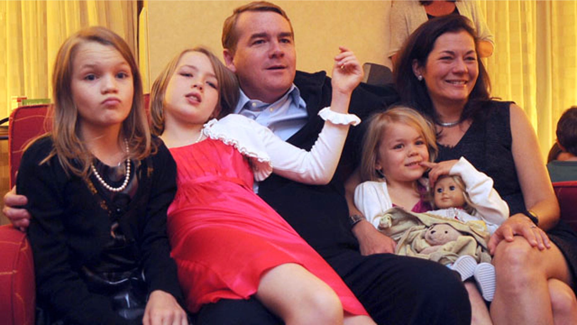 Nov. 2: Democratic candidate for Senate Michael Bennet, center, watches election results with his family at the Marriott in Denver. Into the early hours of the next day, election numbers seemed too close to call.