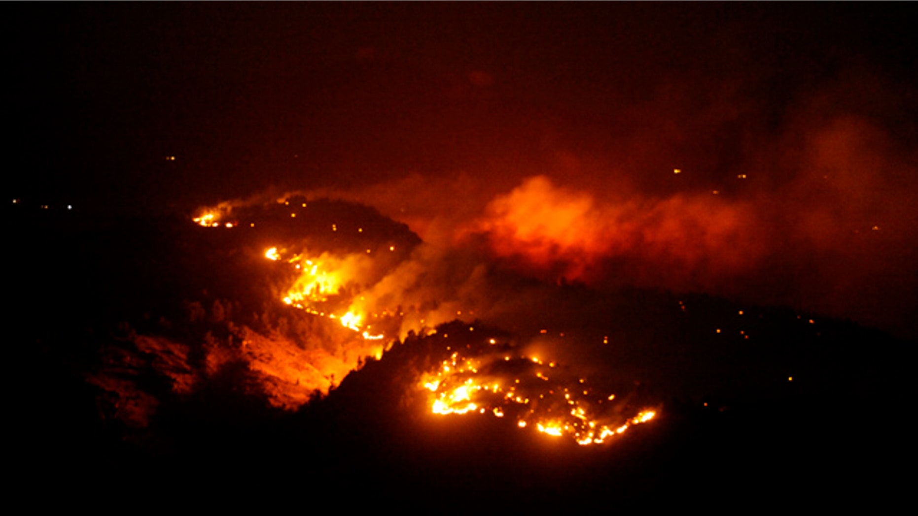 March 21, 2011: In this photo the Indian Gulch fire burns west of Golden, Colo.