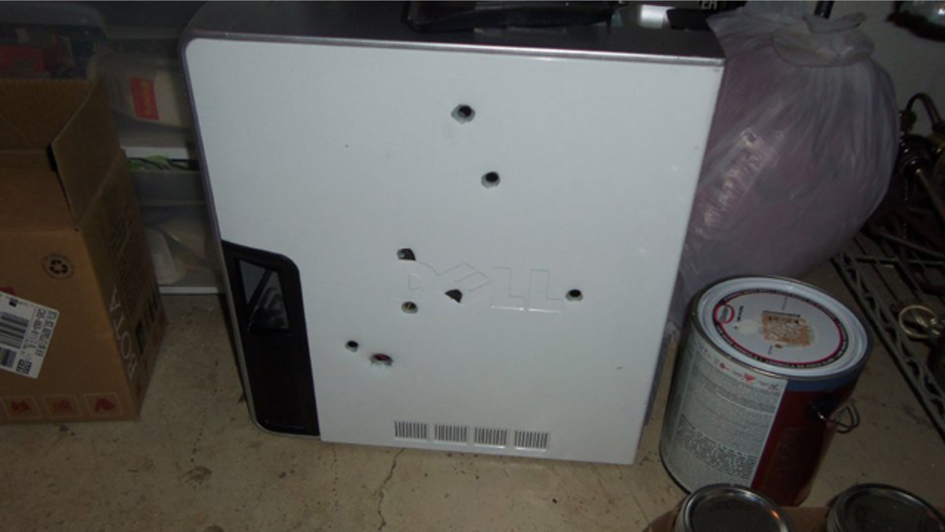 April 20, 2015: This photo shows the remains of a computer that was shot eight times Monday by a Colorado Springs, Colo. man. The man received a citation from police. (Courtesy Colorado Springs Police Department)