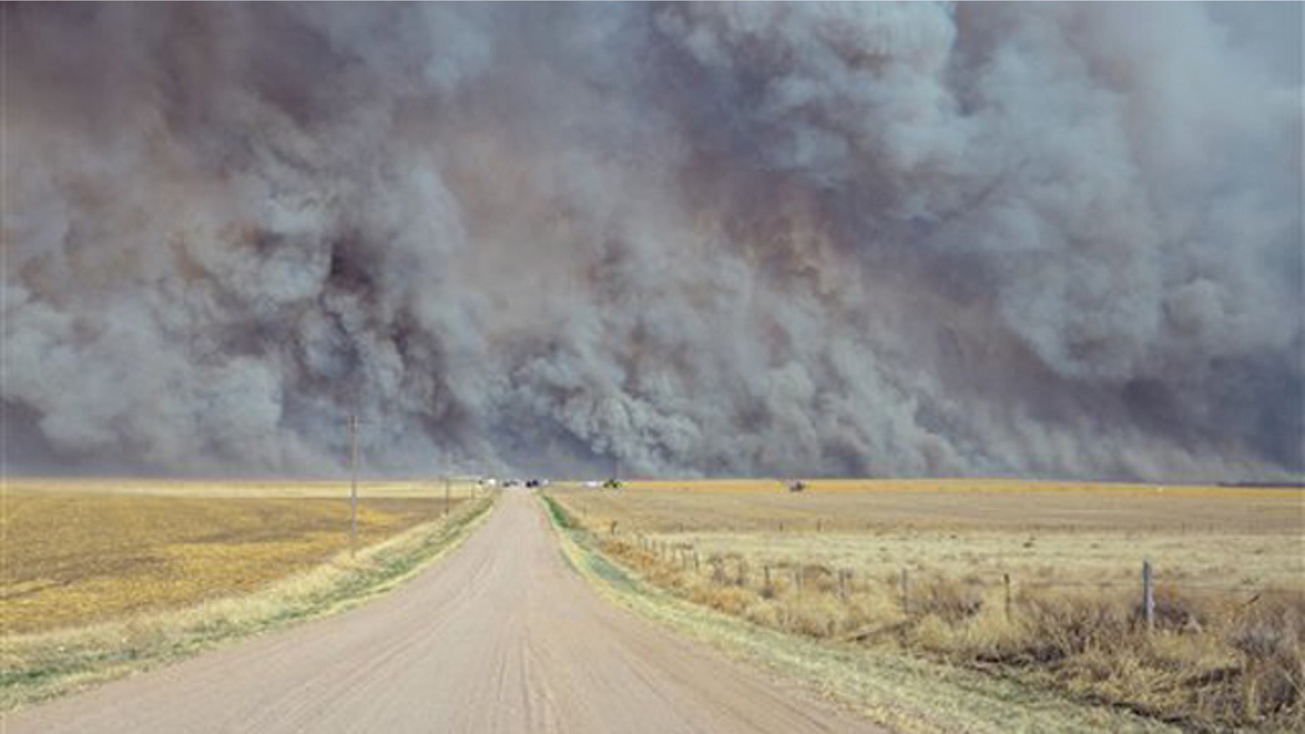March 18, 2012: A wildfire sends up a huge wall of smoke, forcing authorities to temporarily close a section of U.S. Highway 34 east of Yuma County, Colo., when the fire filled the skies with so much smoke that firefighters couldn't see the flames.
