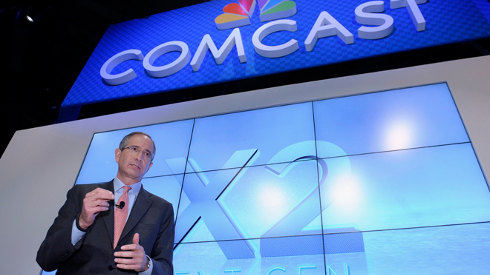FILE - This June 11, 2013 file photo shows Comcast Corp. CEO Brian Roberts during The Cable Show 2013 convention in Washington. Comcast, the nation's biggest cable colossus, plans to swallow runner-up titan Time Warner Cable. This $45 billion deal would give Comcast 30 million subscribers in 43 of the nation's top 50 markets and about 30 percent of pay TV customers. (AP Photo/Susan Walsh, File)